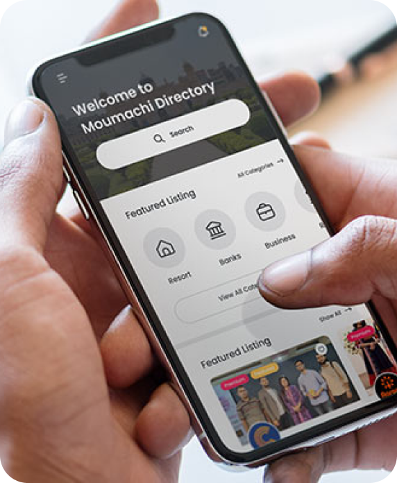 Hands holding a phone with the Moumachi directory home screen